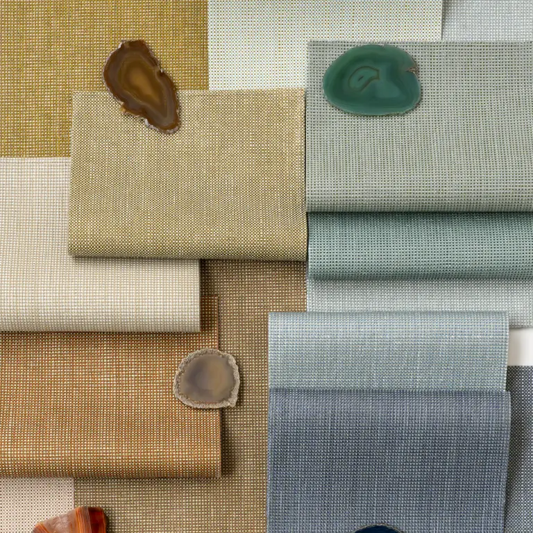 Samples of Vescom Gemstone woven textile wallcovering in gemstone-inspired colours showing the small grid texture